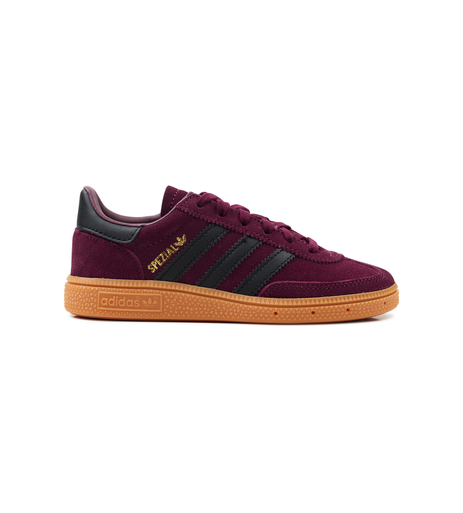 Maroon Adidas sneaker with black stripes on a white background
