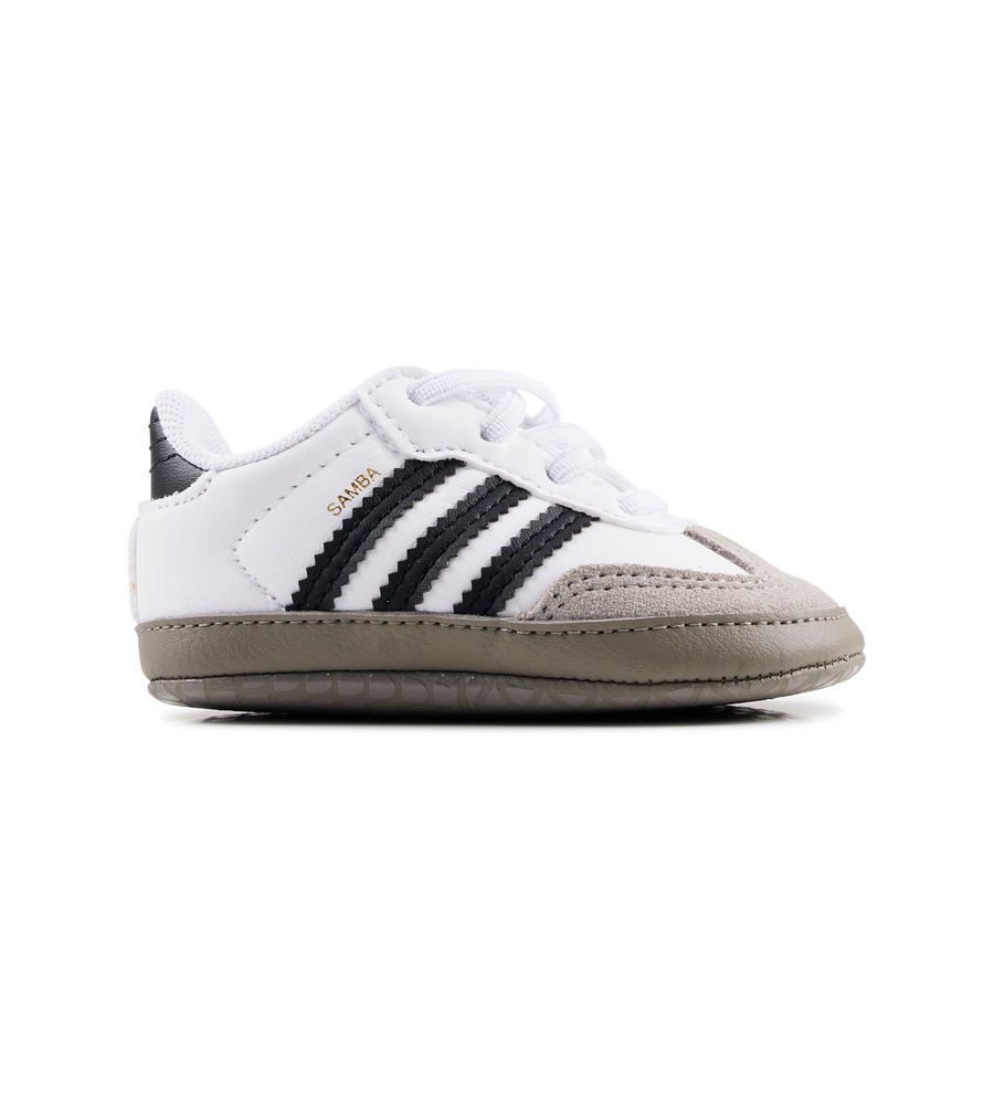 White baby shoe with black stripes on a white background