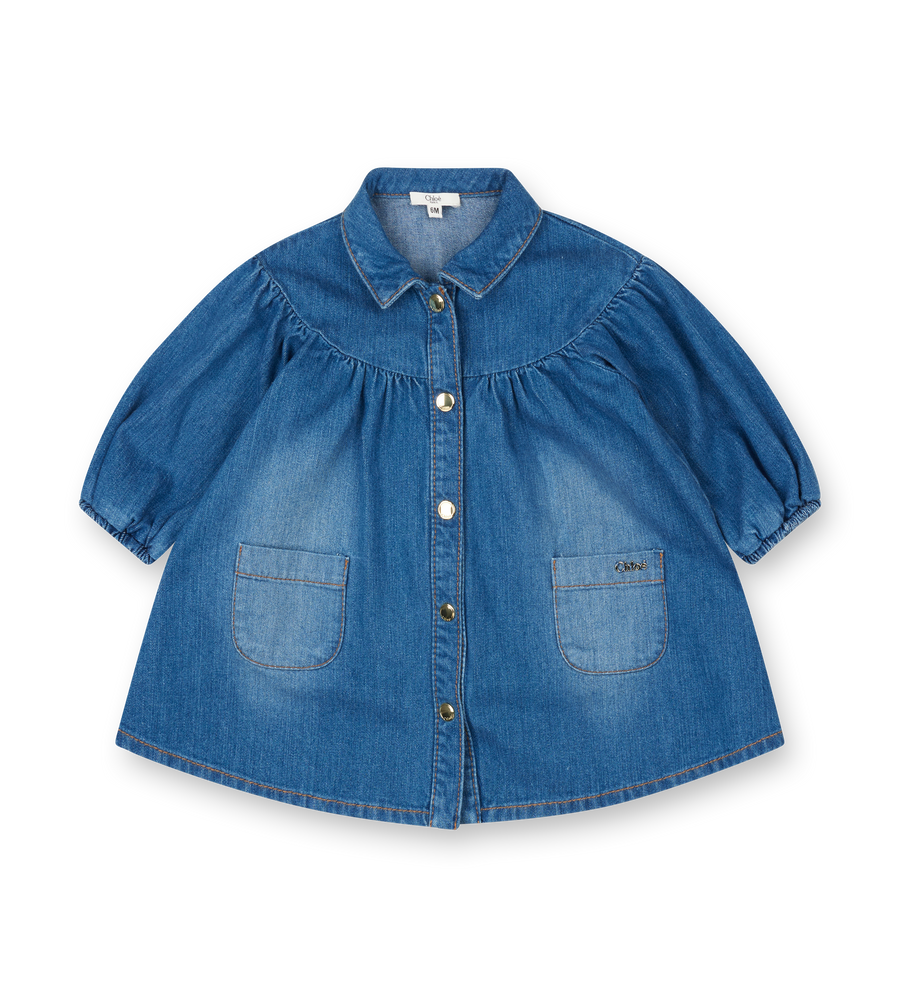 Blue denim dress with puff sleeves on a white background