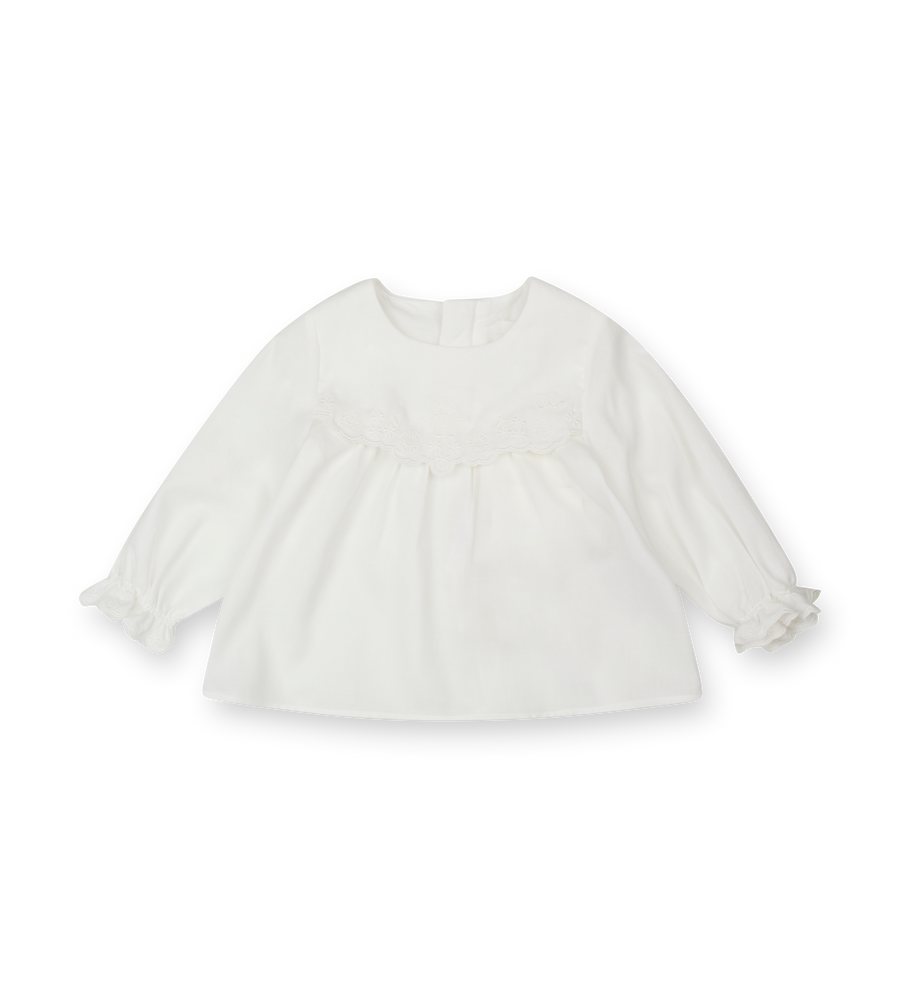 White blouse with sheer sleeves on a white background