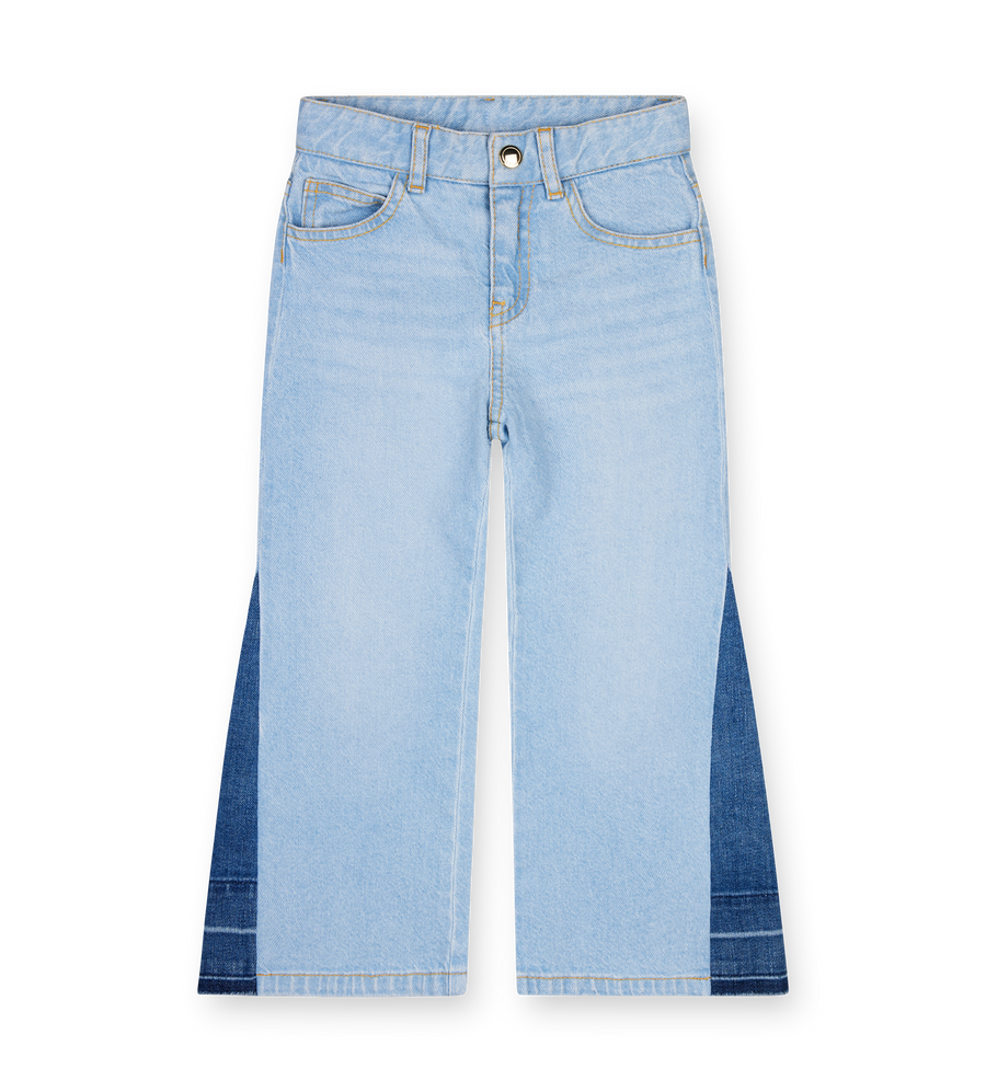 Light blue jeans with a white background