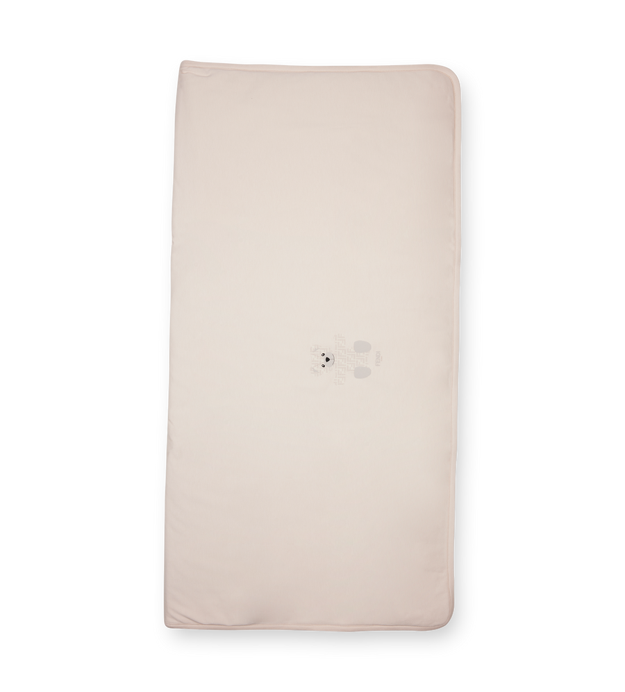 Beige mattress cover on a white background