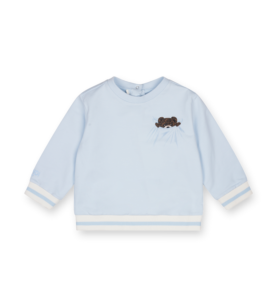 Light blue baby sweater with a dark logo on a white background