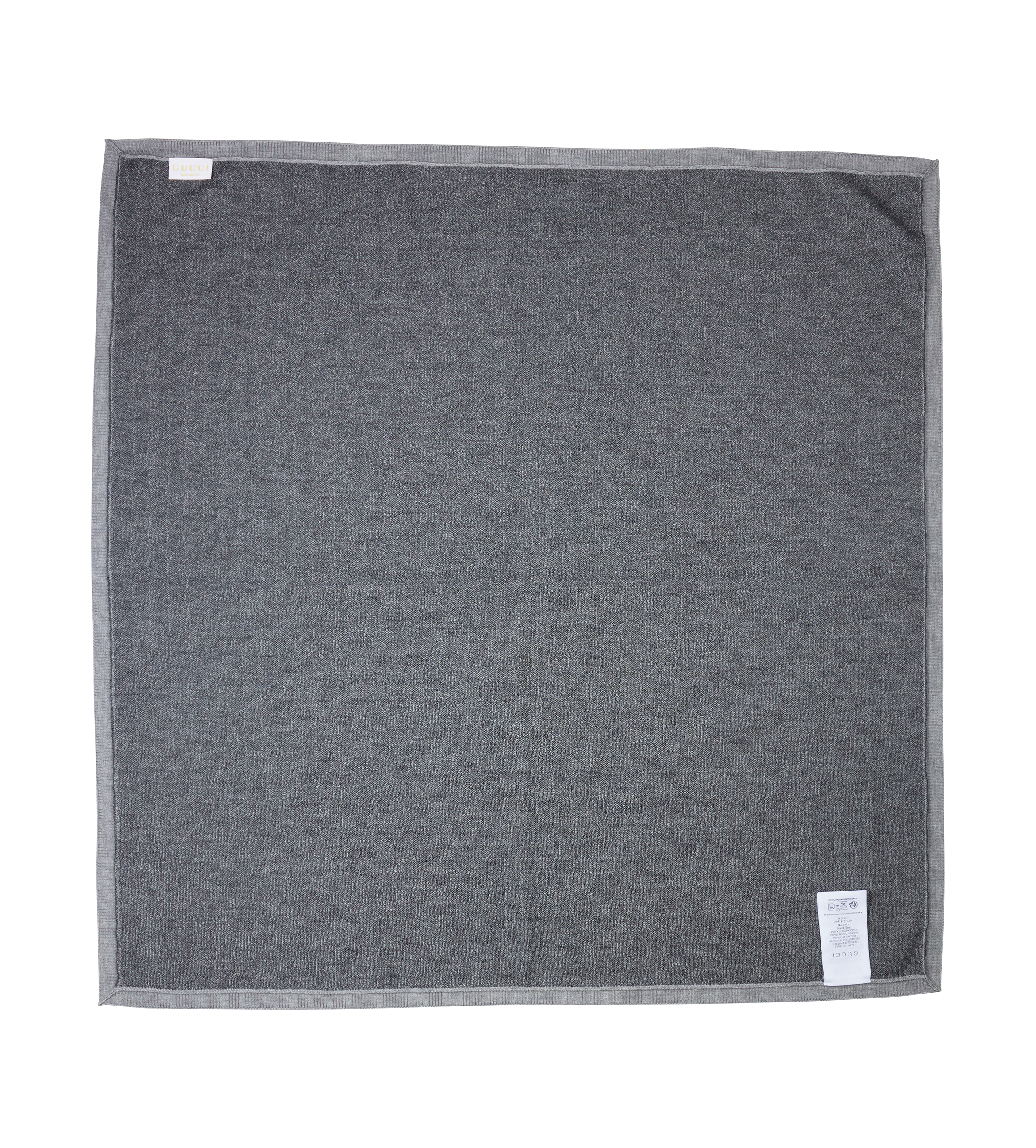 Gray towel with tags on a white background