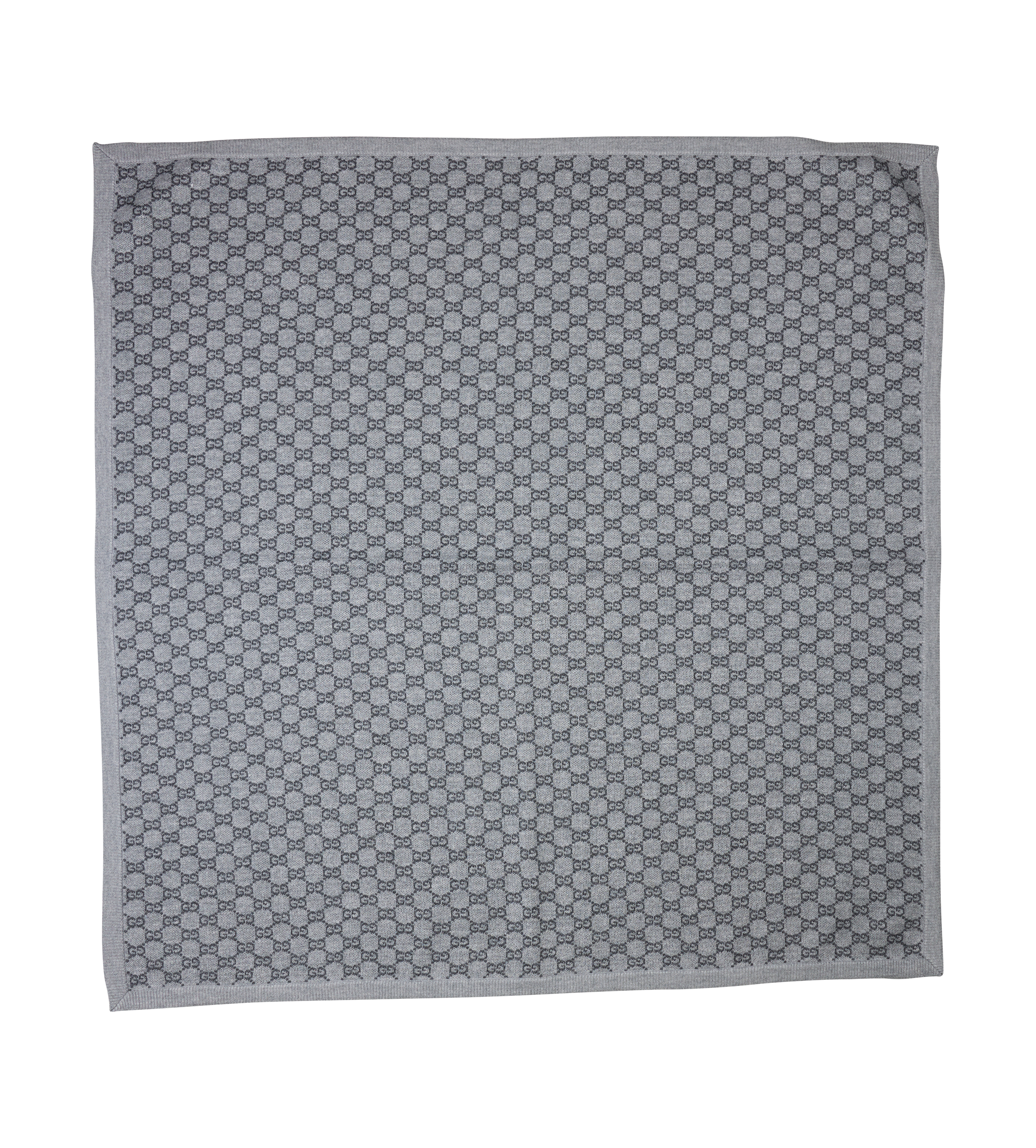 Gray patterned fabric square on a white background