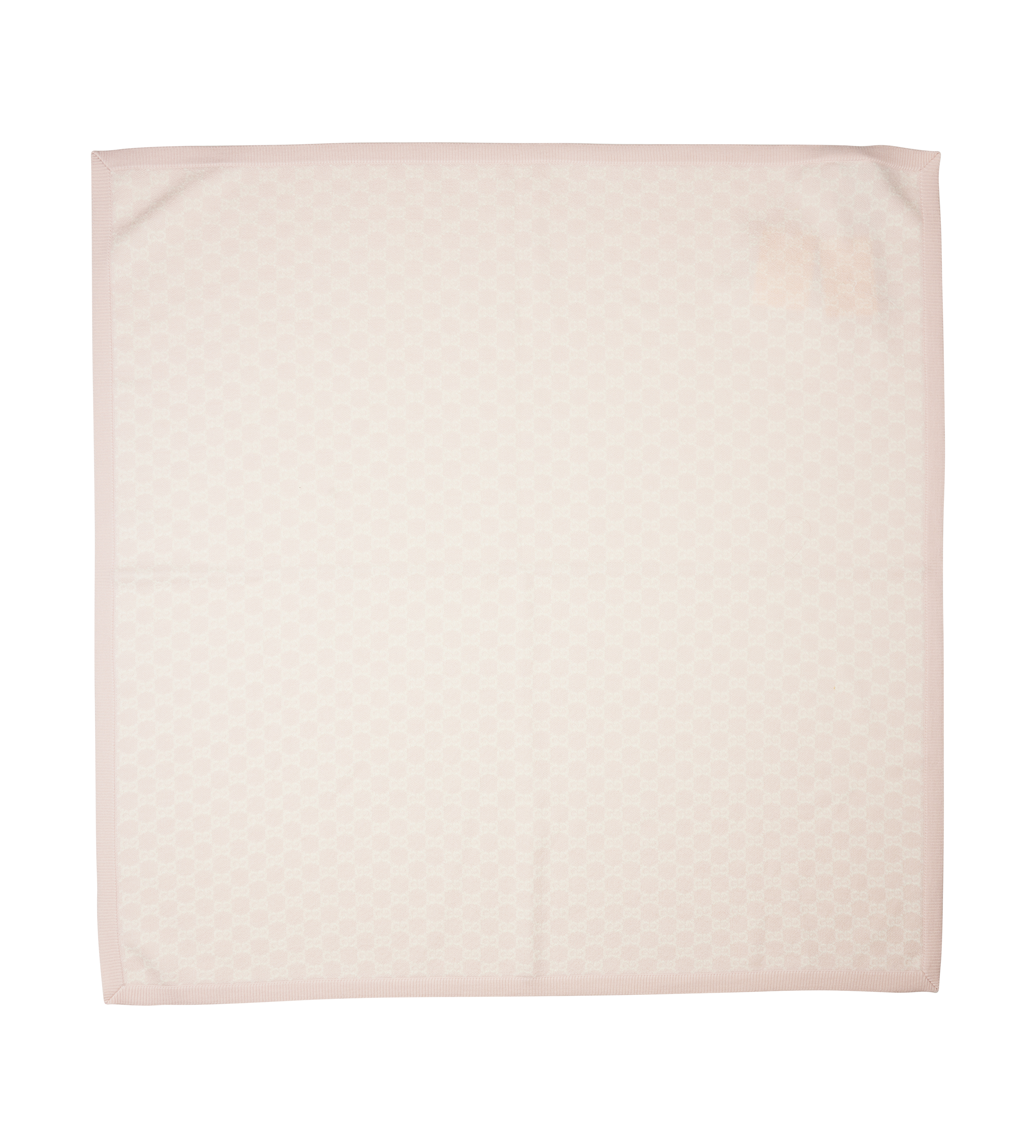 Quilted blanket with a subtle pattern on a white background