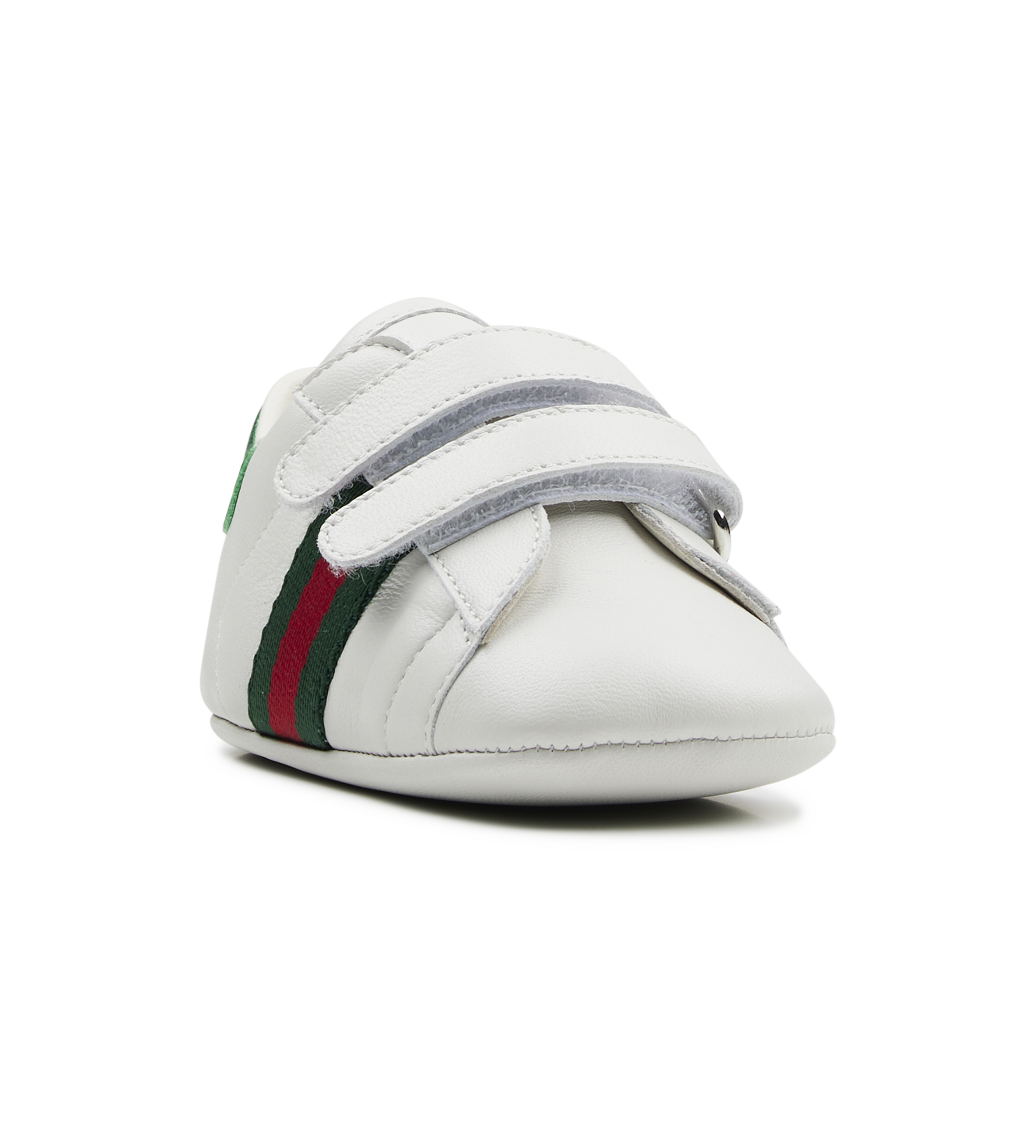 white baby shoe with green and red stripes