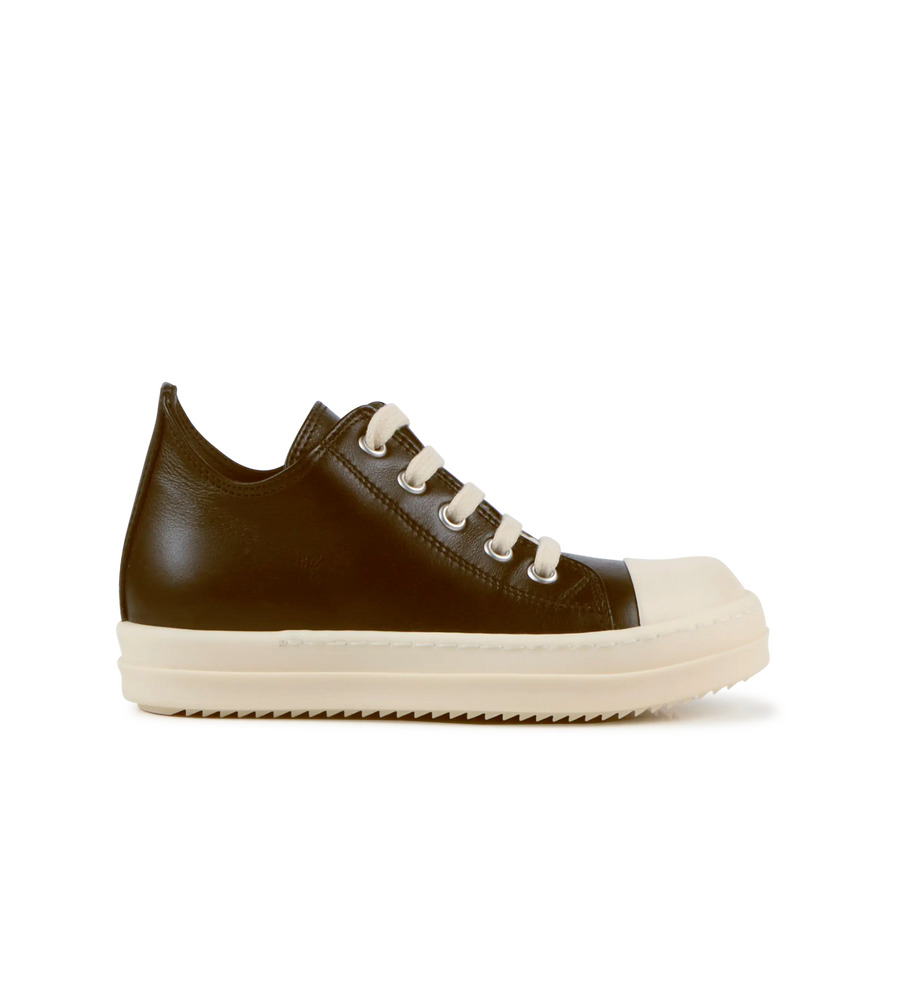 Brown leather sneaker with white laces on a white background