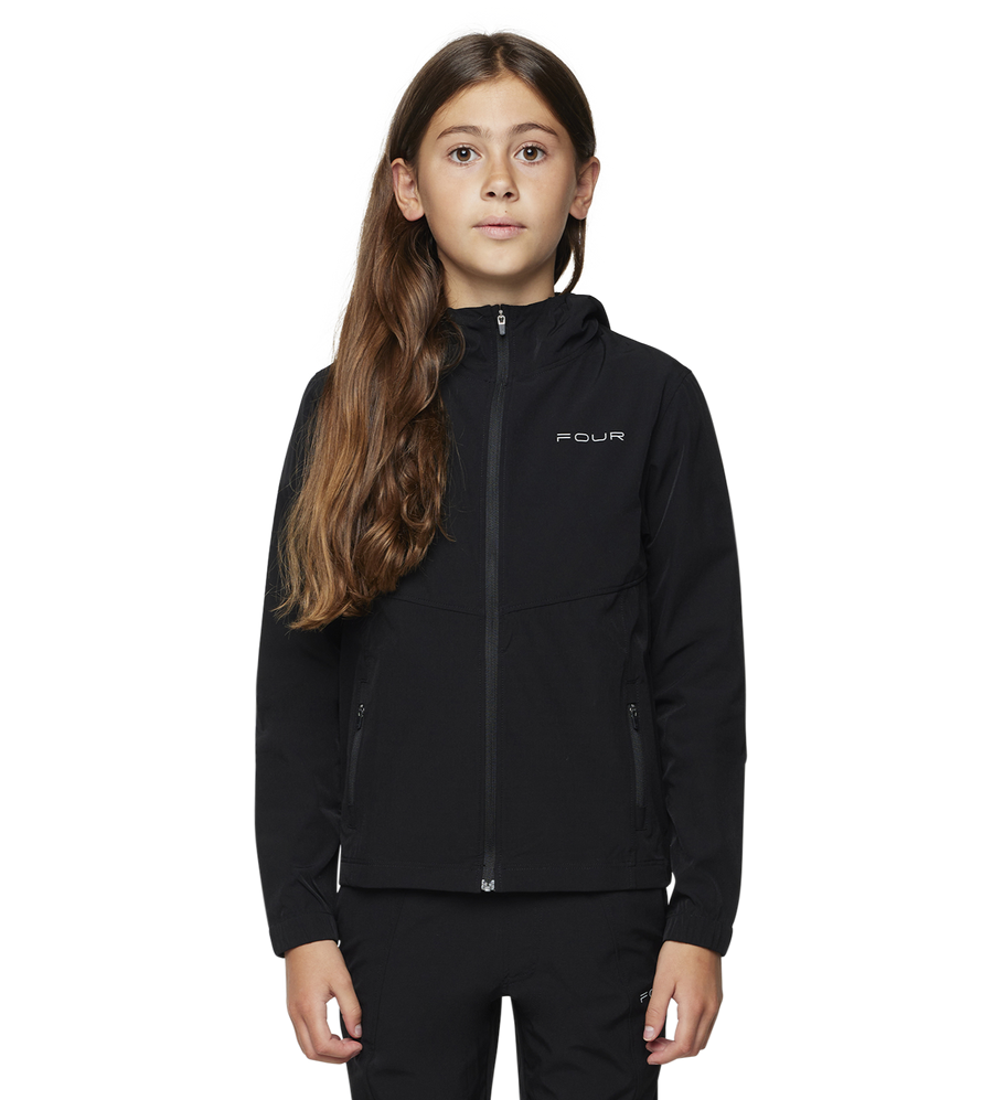 Person wearing a black jacket with a brand logo on a white background