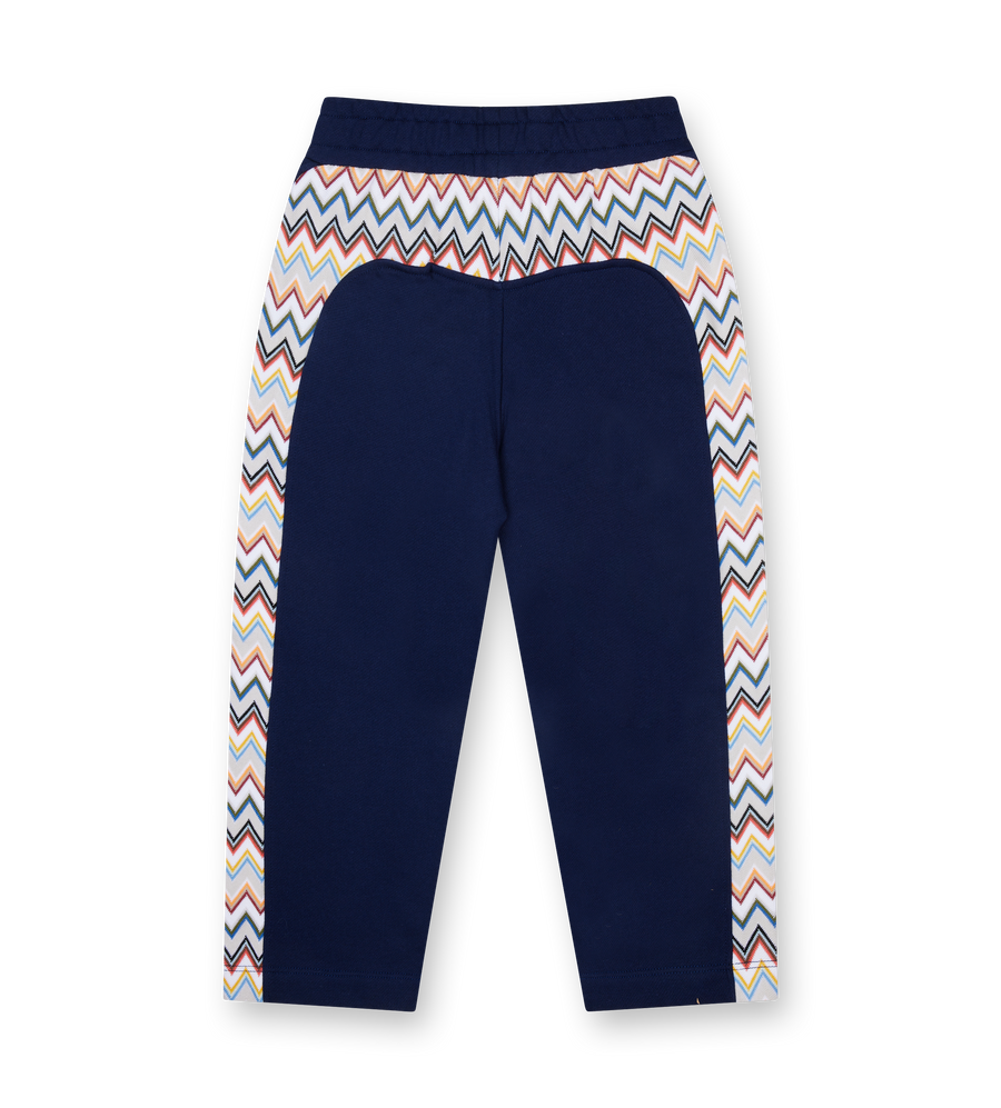 Navy blue pants with multicolored zigzag pattern on a white background