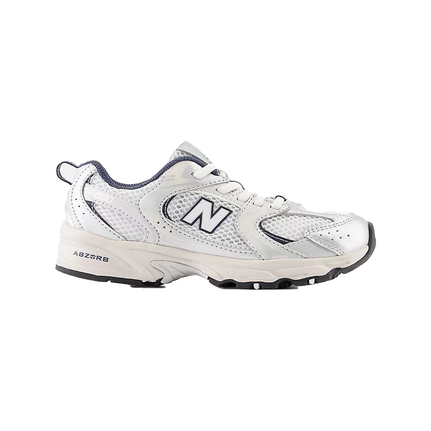 A pair of New Balance kids' sneakers for boys and girls, in white color with the New Balance logo, designed for casual wear.