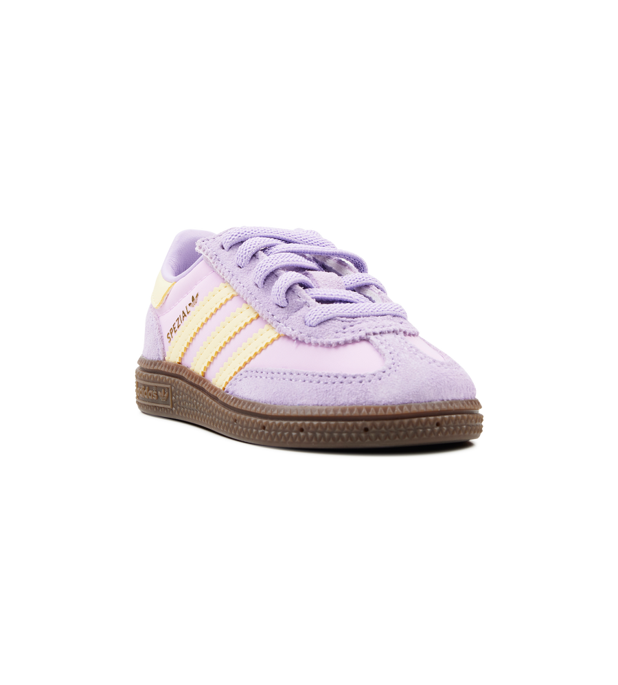 Purple and yellow baby shoe on a white background