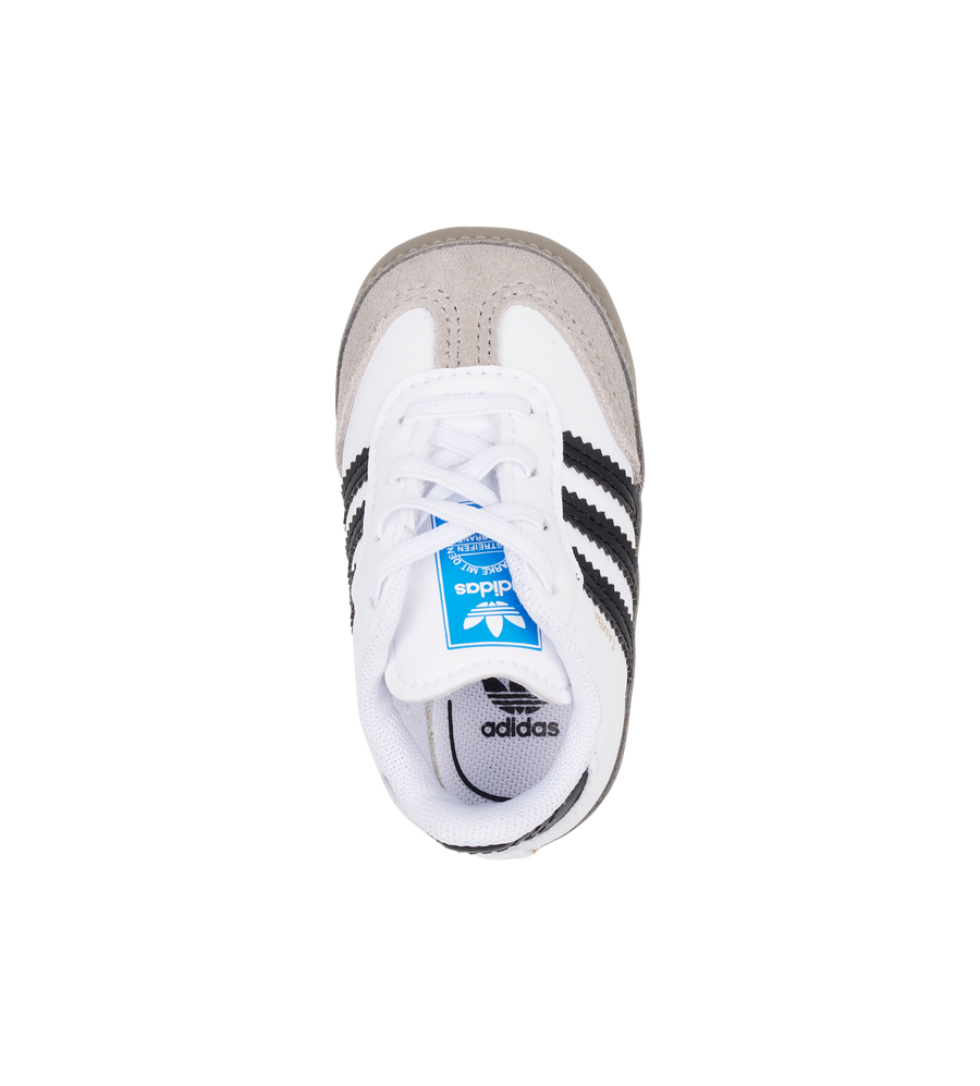 White Adidas sneaker with black stripes on a white background