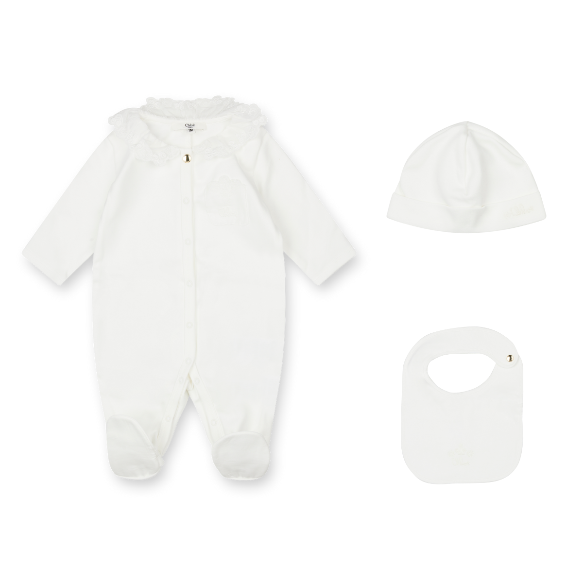 White baby onesie, hat, and bib set on a white background