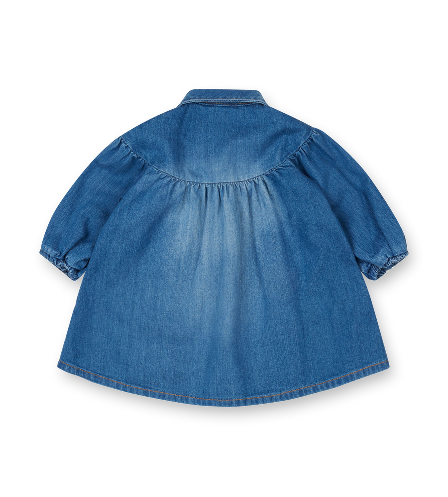 Blue denim dress on a white background