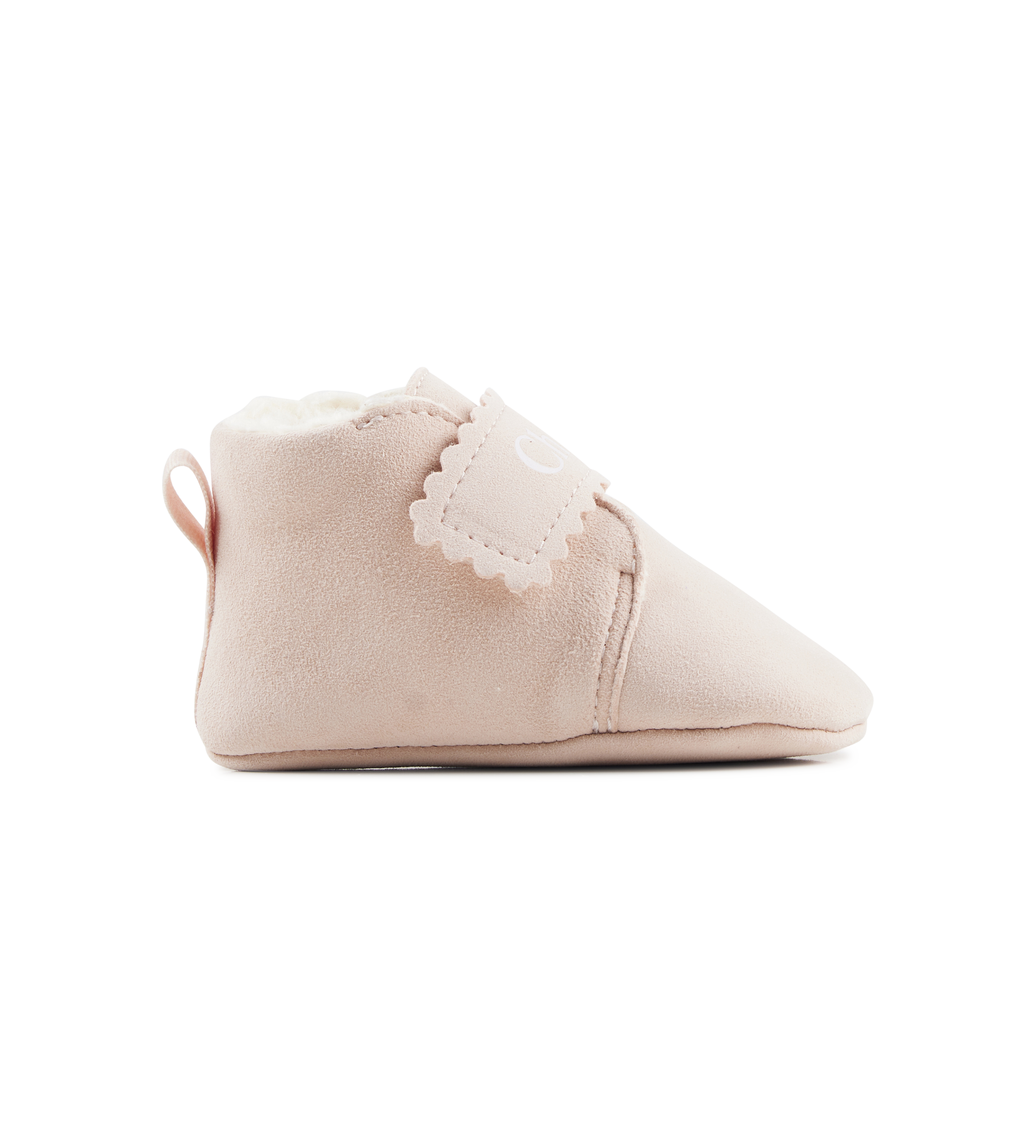 Pink baby bootie with lace trim on a white background
