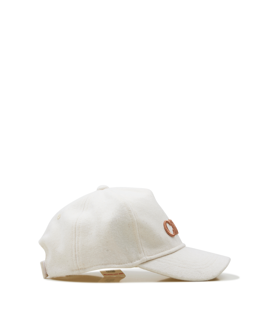 White cap with a brown logo on a white background