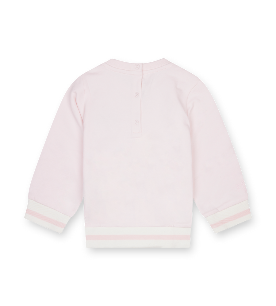 Light pink baby cardigan on a white background