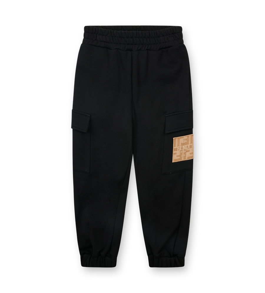 Black cargo pants with a patch on a white background