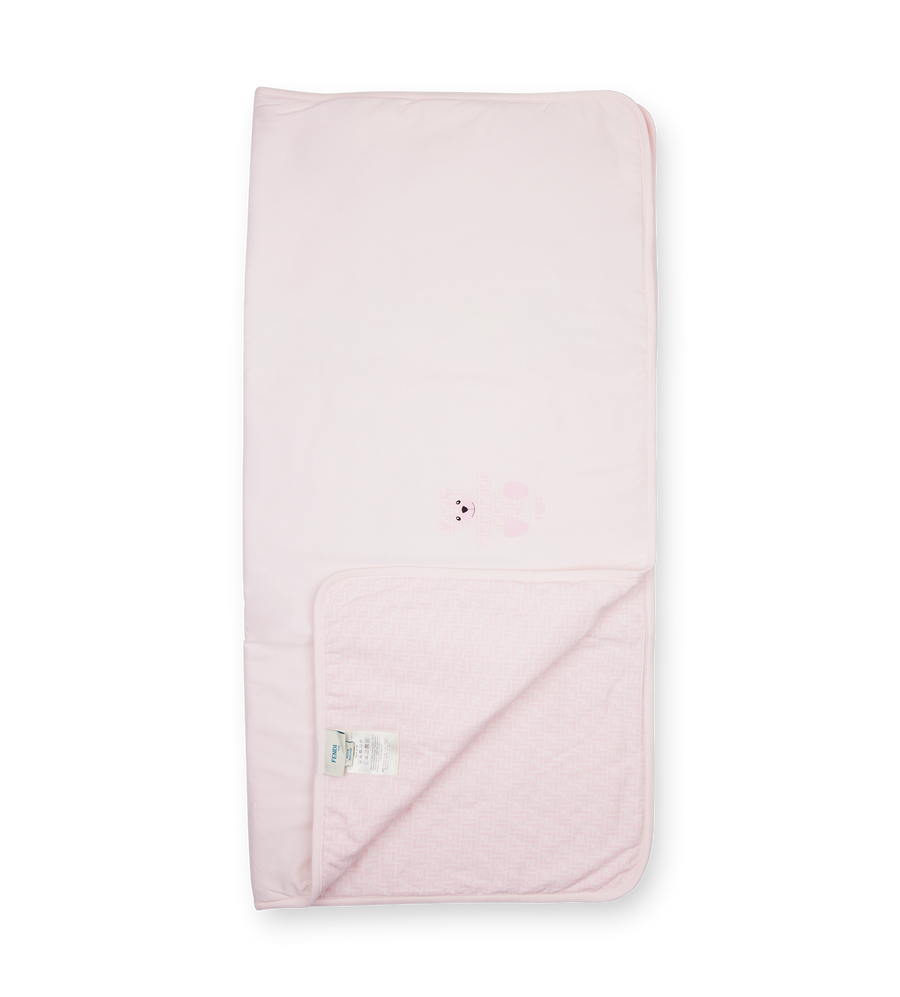 Pink baby blanket with a brand logo on a white background