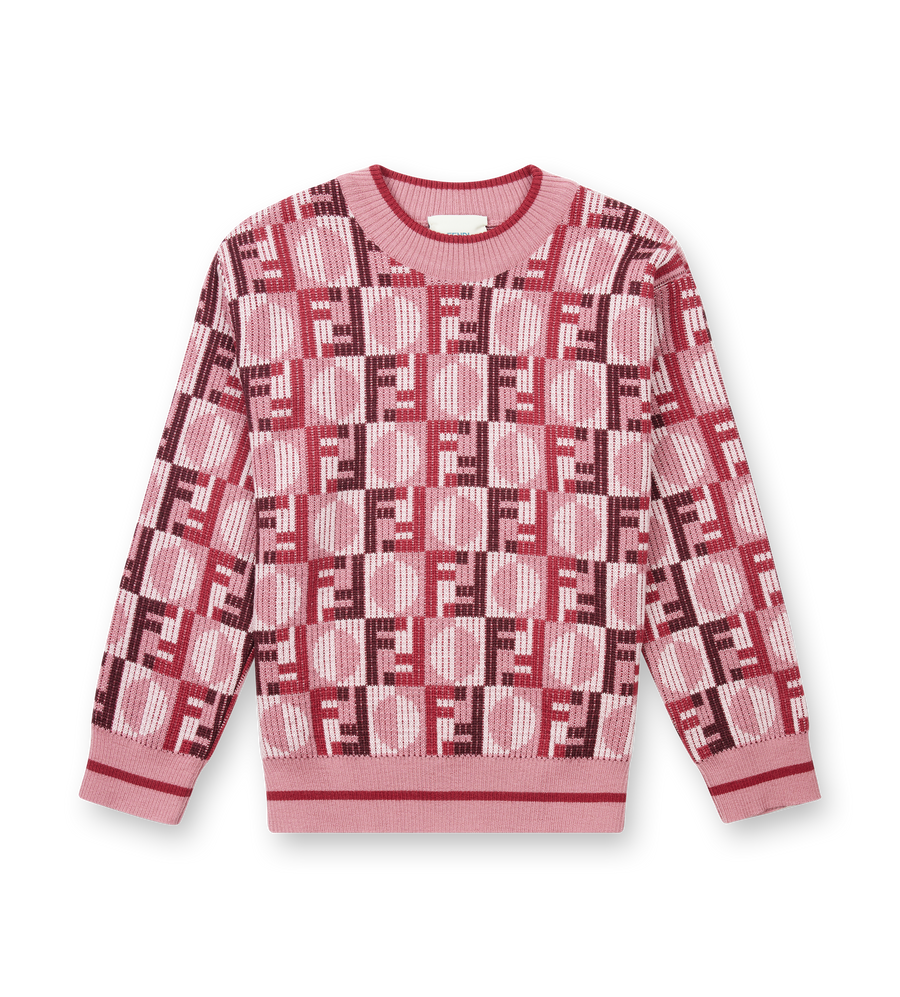 Pink sweater with geometric pattern on a white background