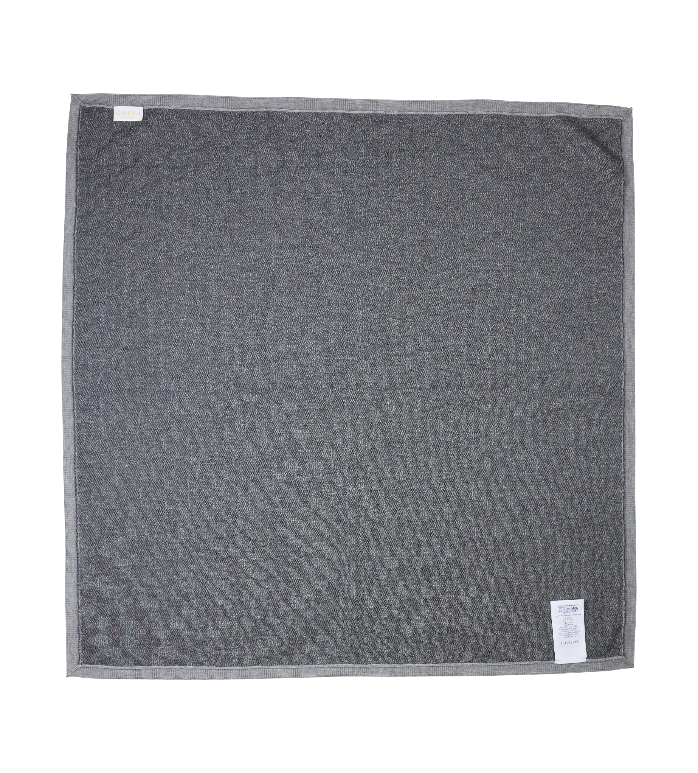 Gray towel with tags on a white background