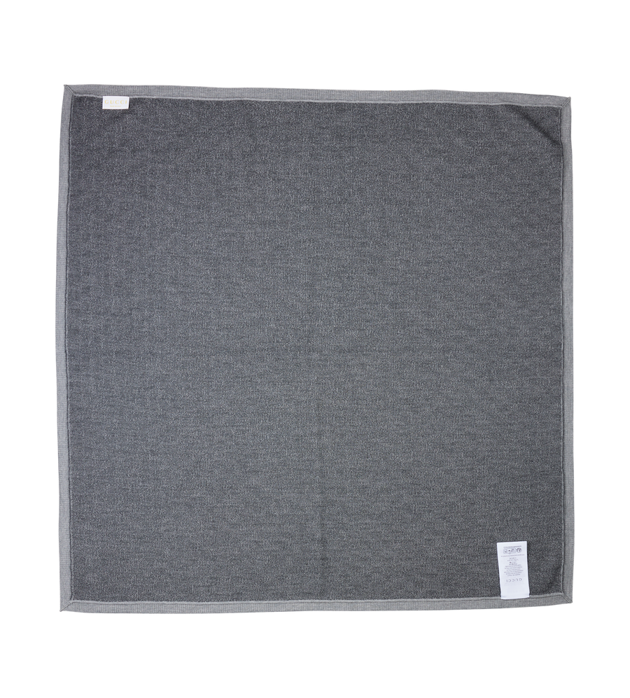 Gray towel with tags on a white background