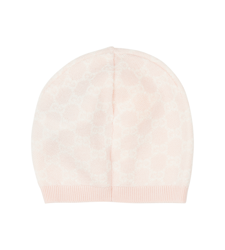 Beige knit beanie on a white background