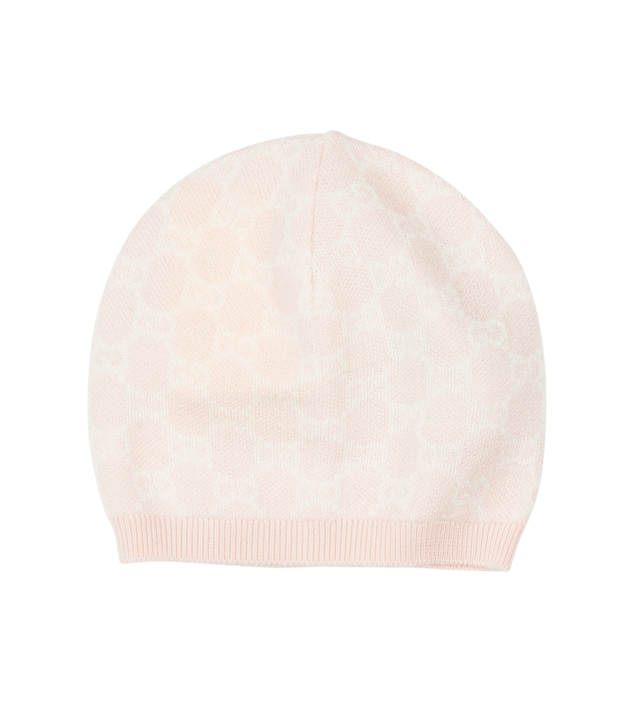 Beige knit beanie on a white background