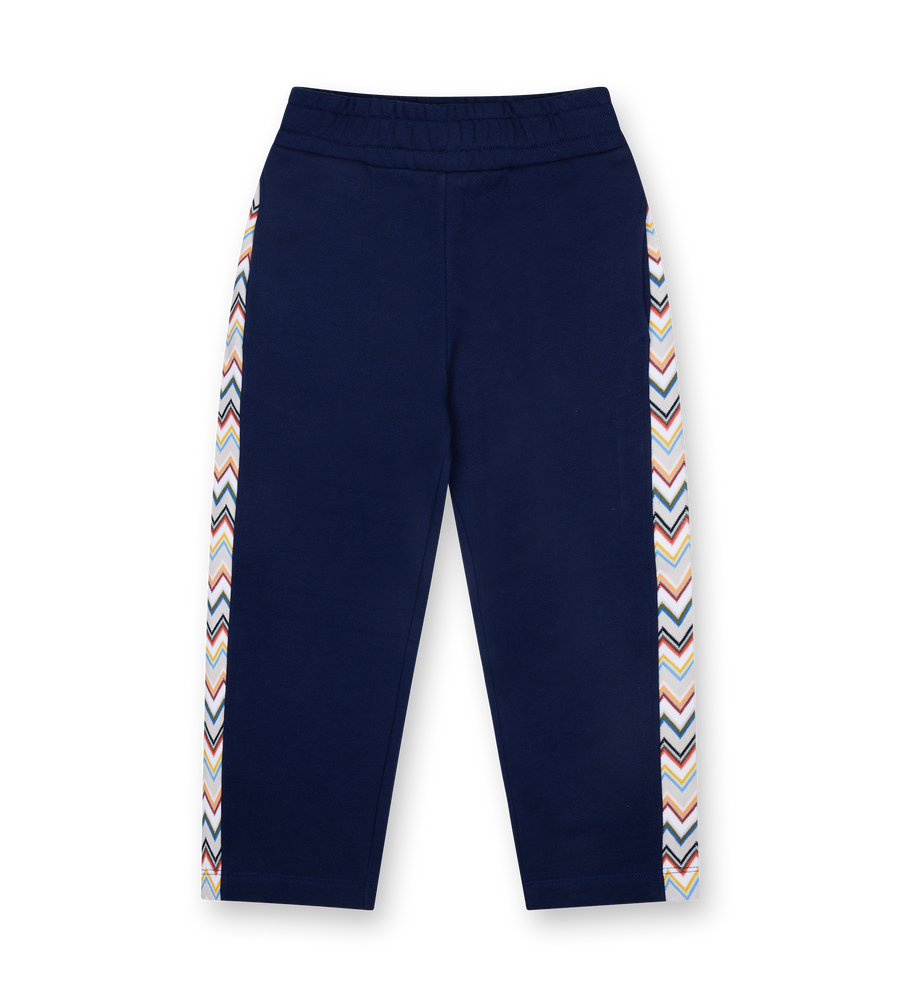 Navy blue pants with colorful striped sides on a white background