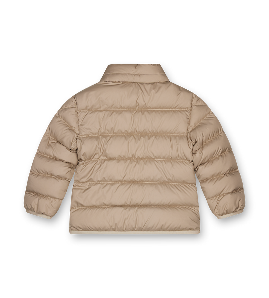 Beige puffer jacket on a white background