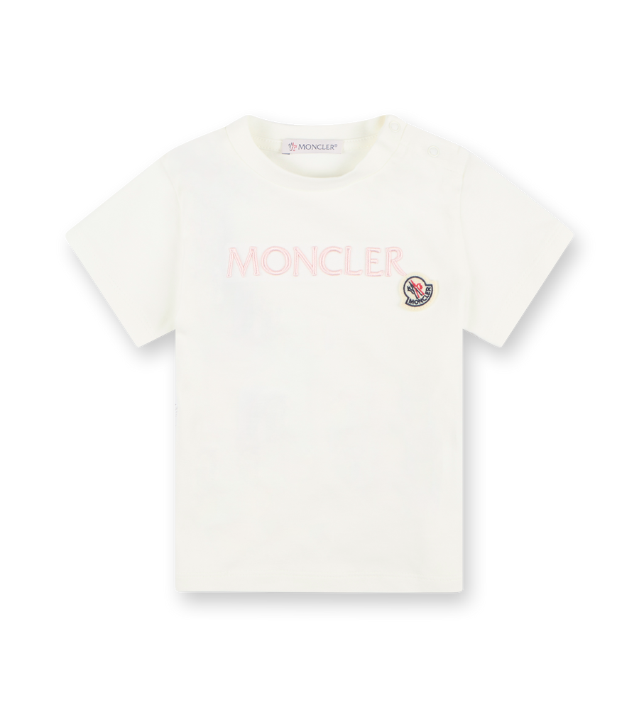 White short-sleeved Moncler t-shirt with embroidered logo on the chest and a snap button closure on the shoulder.