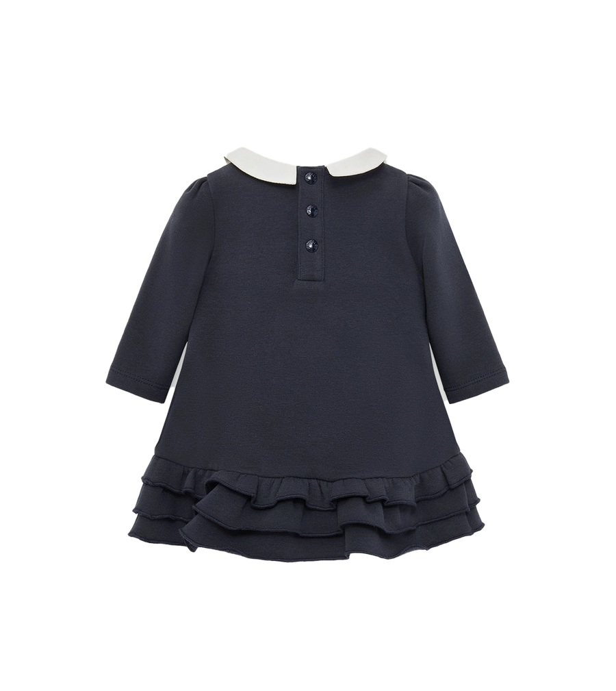 Navy dress with white collar on a white background