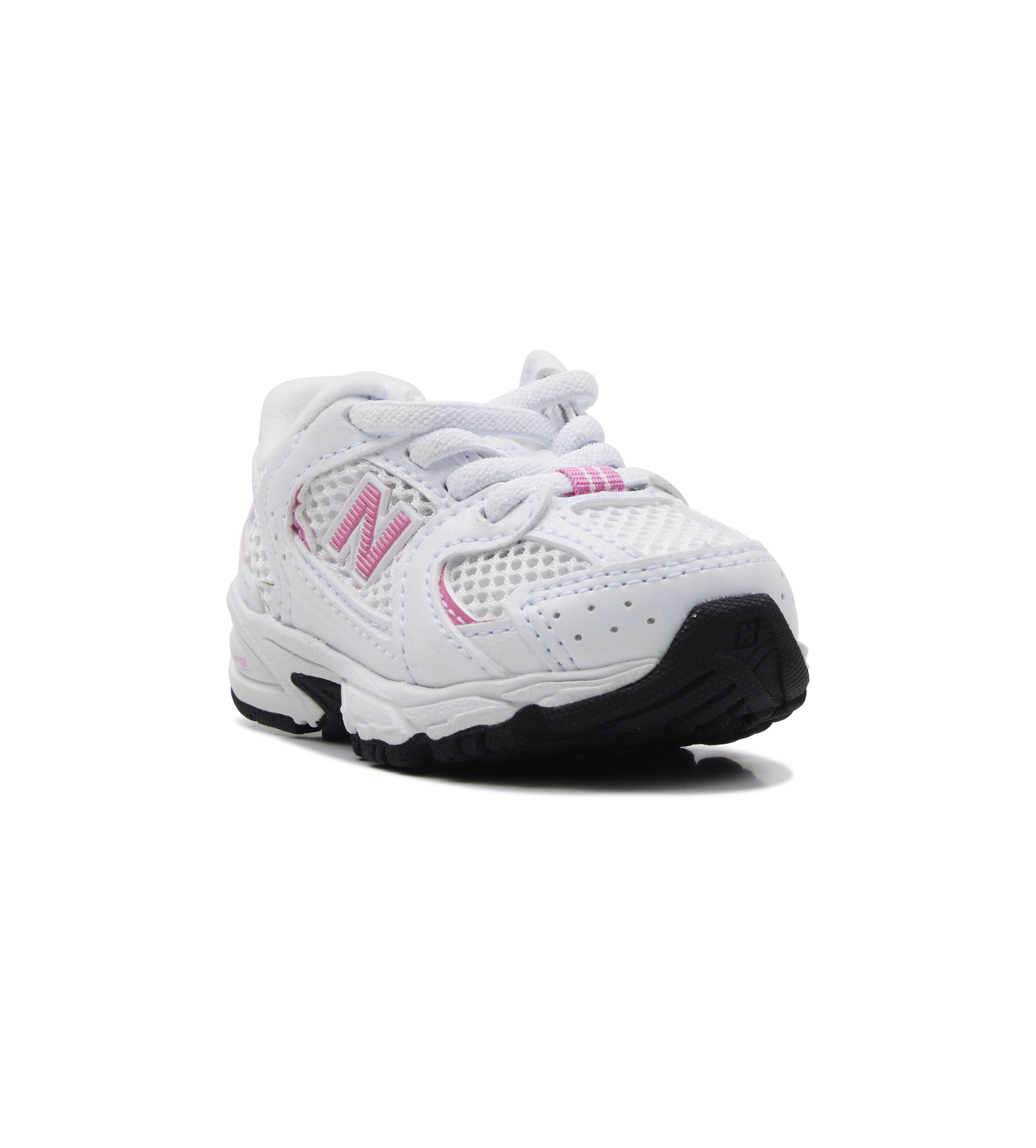 White children's sneaker with pink accents on a white background