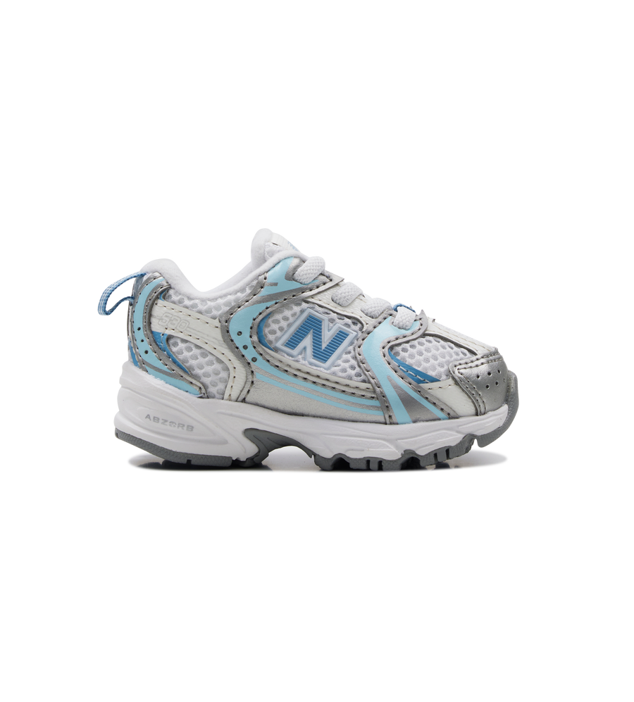 Gray and blue sneaker with New Balance logo on a white background