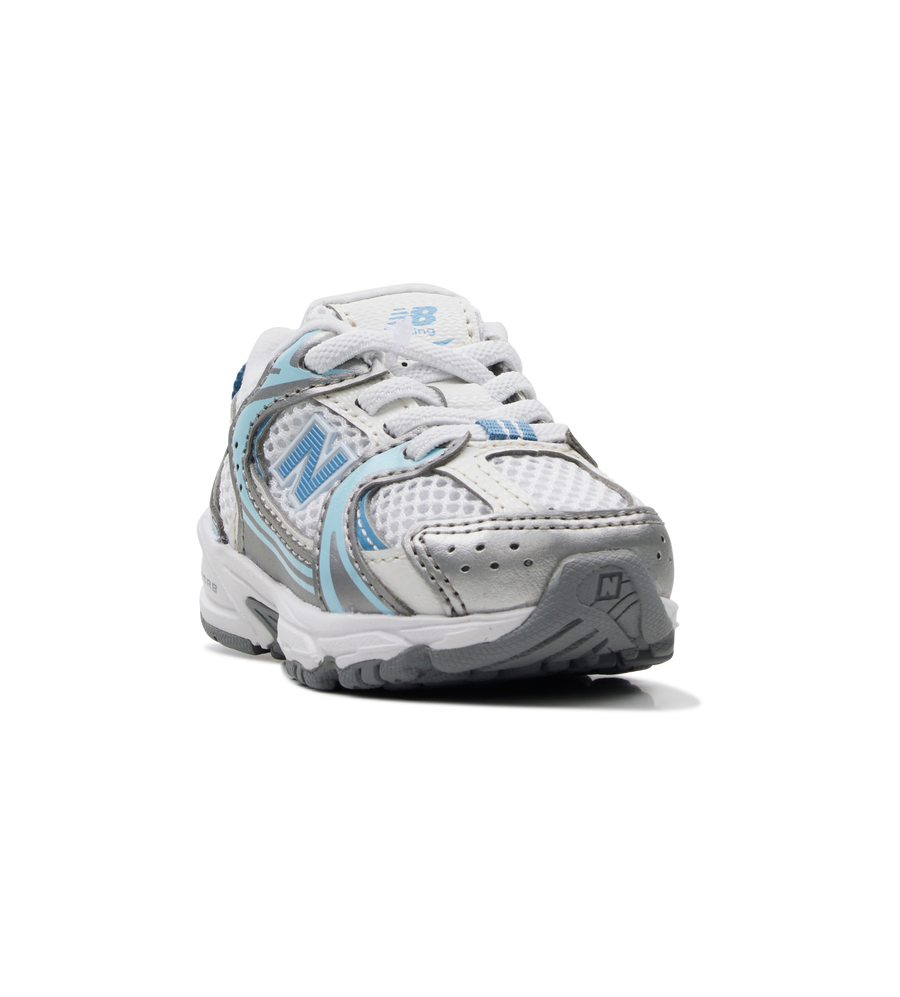 White and blue athletic shoe on a white background