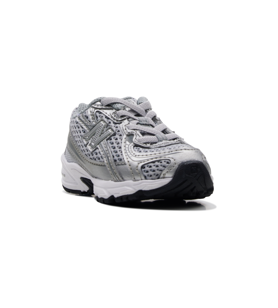 Silver athletic shoe on a white background