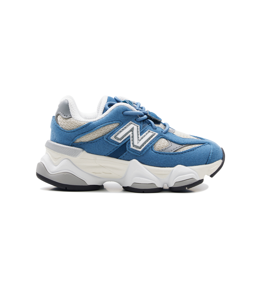 Blue sneaker with white sole on a white background