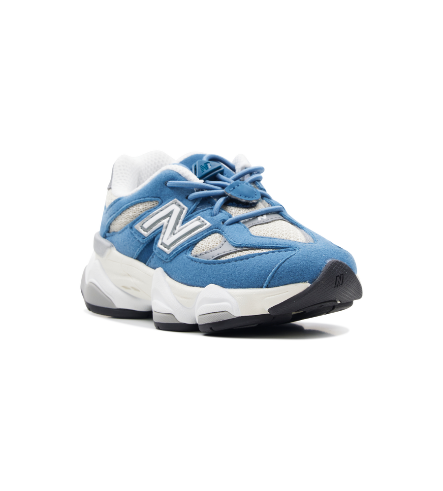 Blue and white sneakers with New Balance logo on a white background