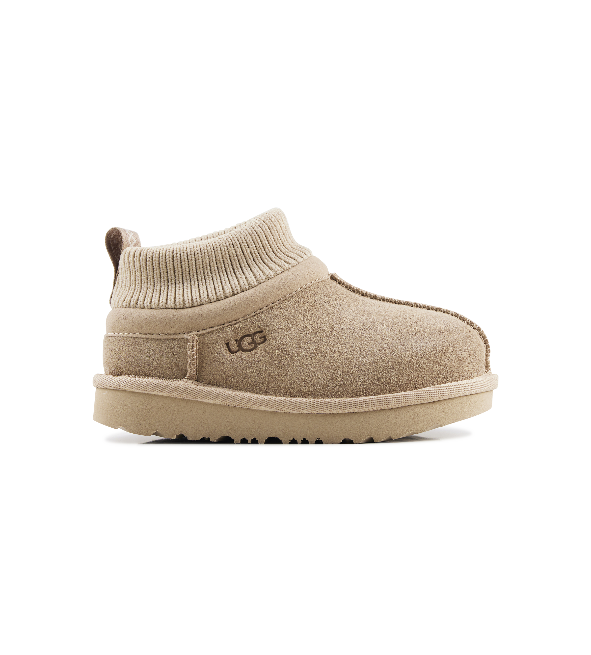Beige UGG boot on a white background