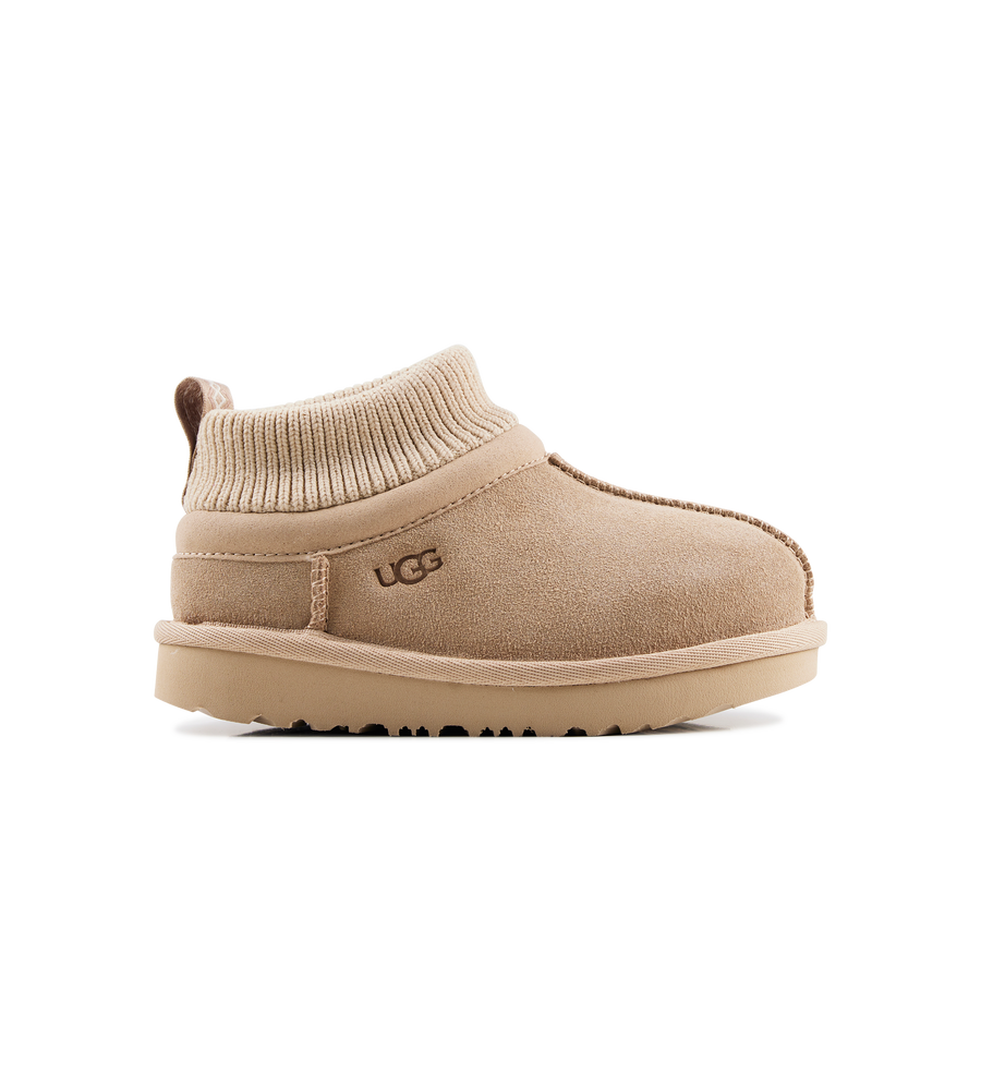 Beige UGG boot on a white background