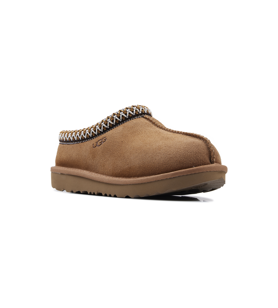 Brown slipper with decorative trim on a white background
