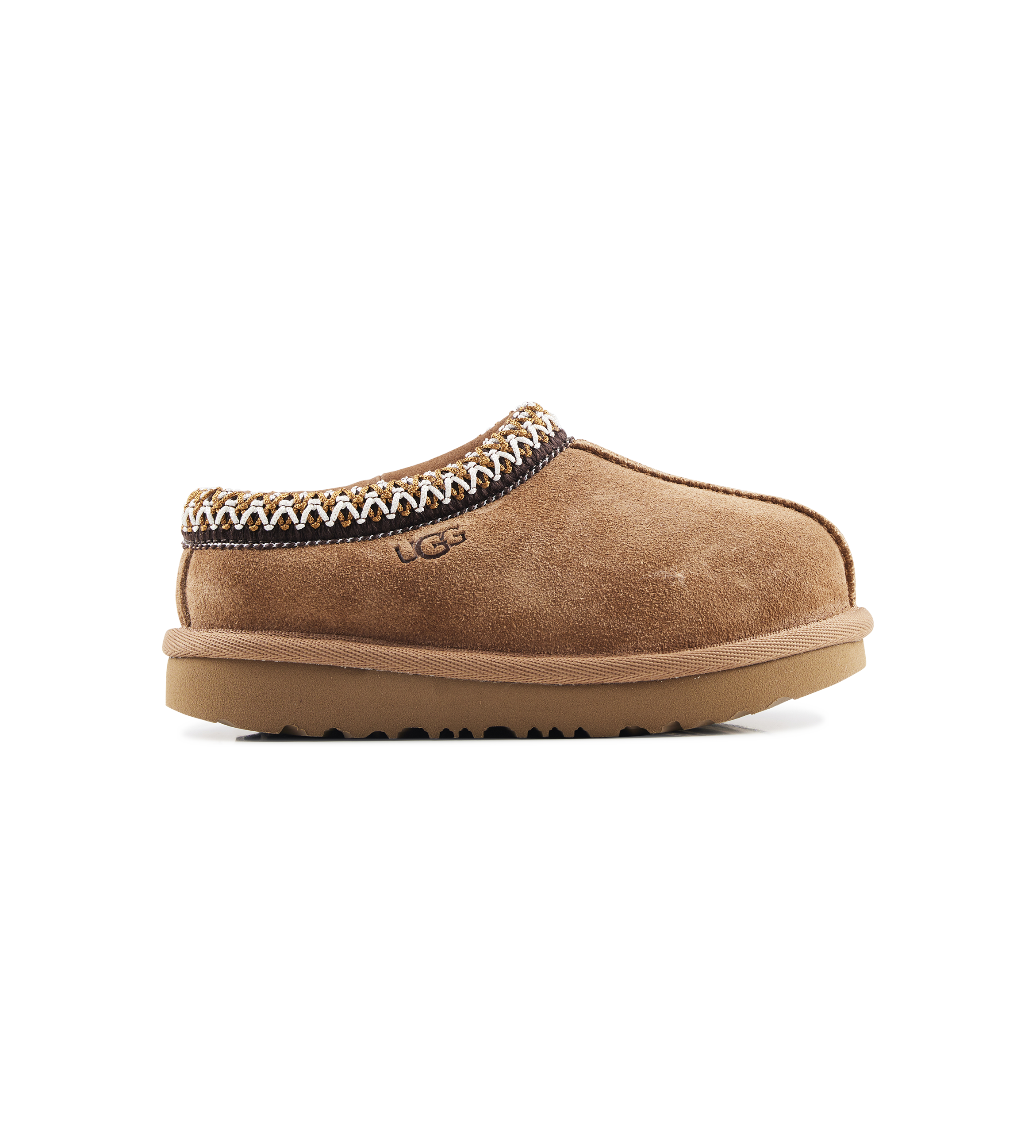 Brown UGG slipper with decorative trim on a white background