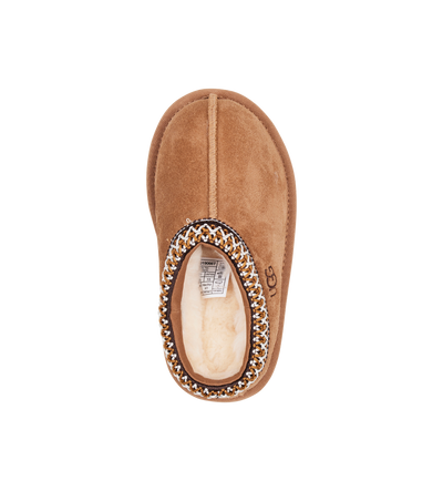 Brown slipper with decorative trim on a white background