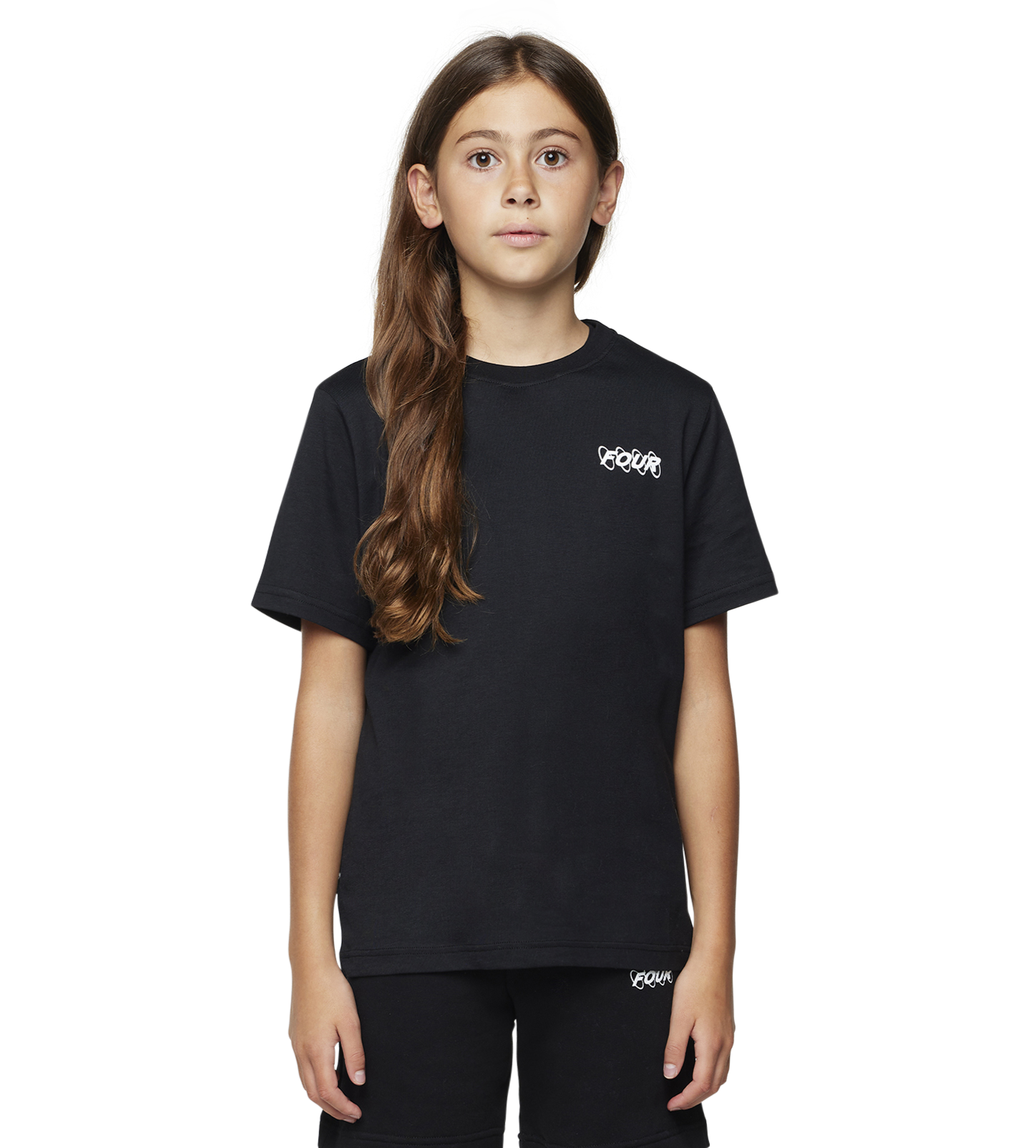 Young girl wearing a black t-shirt and shorts with a brand logo on a white background