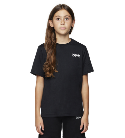 Young girl wearing a black t-shirt and shorts with a brand logo on a white background