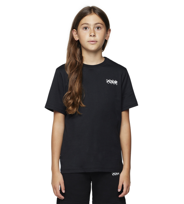 Young girl wearing a black t-shirt and shorts with a brand logo on a white background